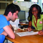 Example image of a student getting help from a staff-member